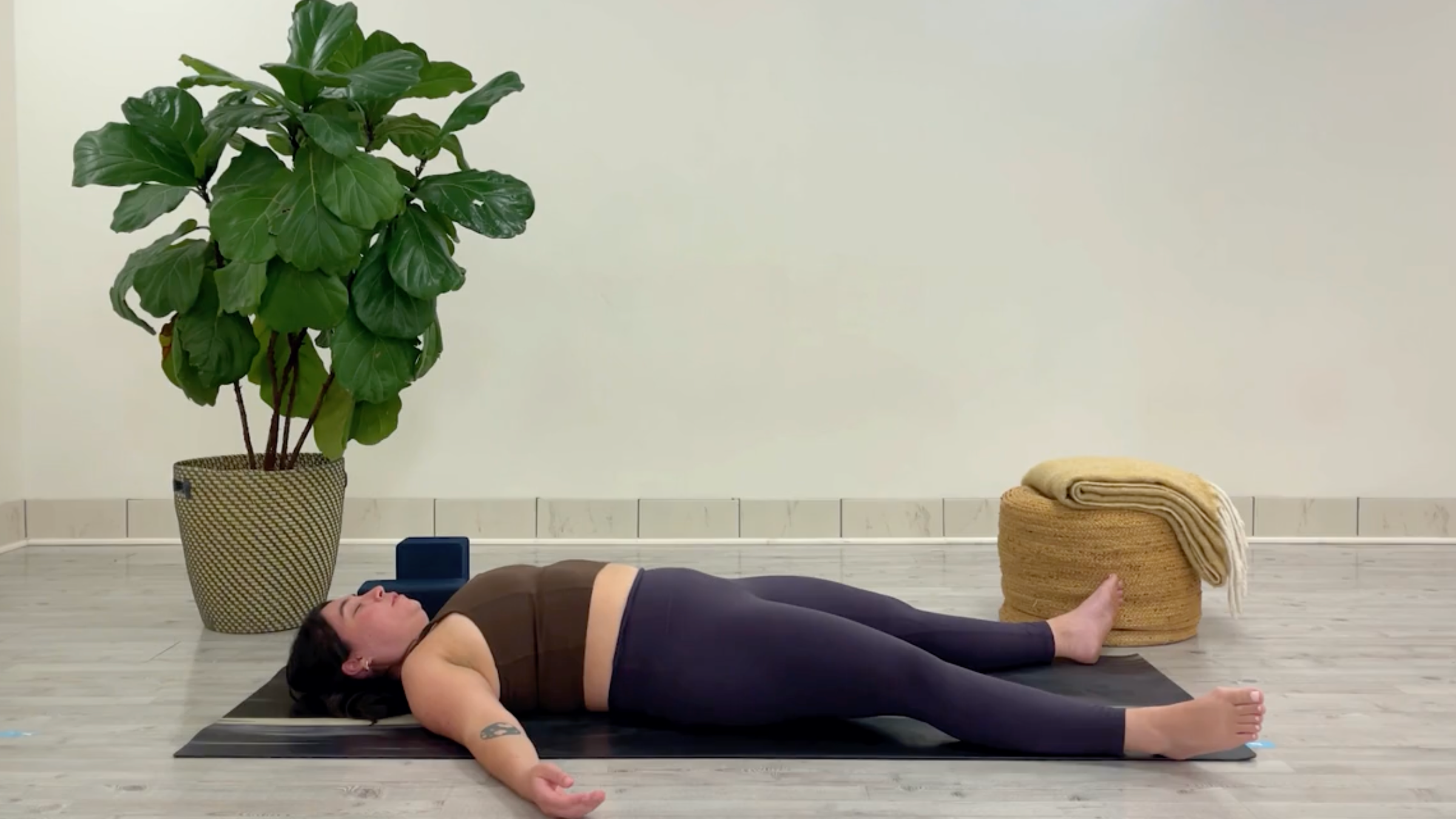 Teacher Taylor Lorenz in Savasana